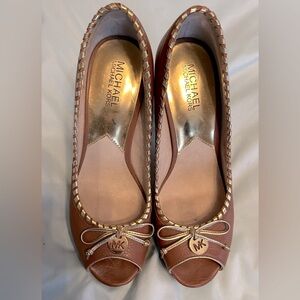 Platform size 9 heels, monogram accents Micheal Kors.